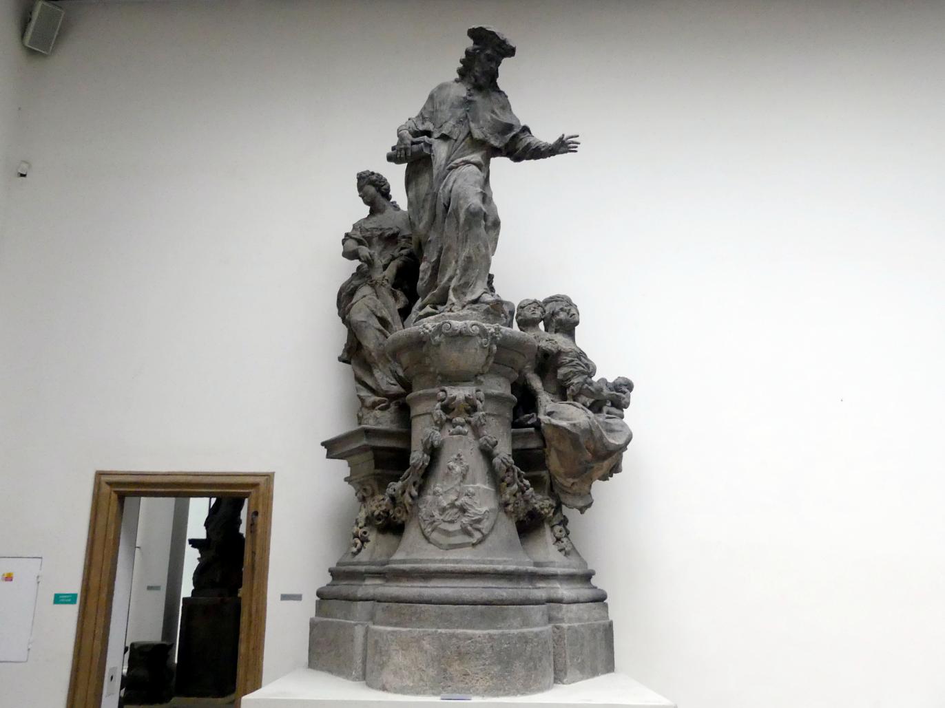 Matthias Bernhard Braun (1710–1725), Figurengruppe mit dem Hl. Ivo Hélory von Kermartin, Prag, Karlsbrücke, jetzt Prag-Holešovice, Lapidarium, Saal 4, 1711